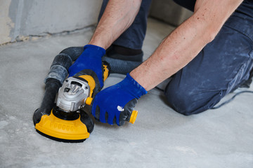 concrete floor surface grinding by angle grinder machine