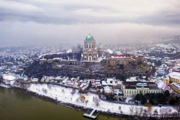 Esztergom, Hungary - Aerial skyline view of Esztergom with the beautiful snowy Basilica on a foggy winter morning