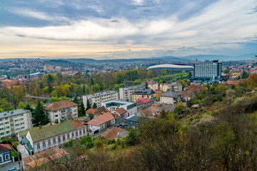 Cluj-Napoca view from Cetatuie hill with Cluj Arena multi-use stadium in the background on a cloudy day in Cluj-Napoca, Romania