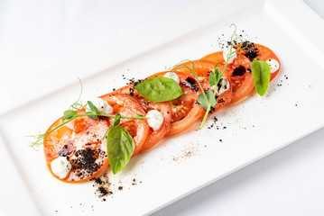 Fresh italian caprese salad with mozzarella and tomatoes