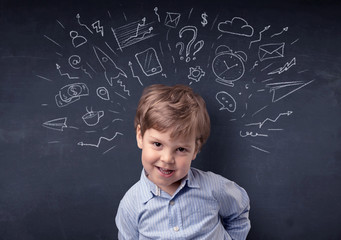 Smart little kid in front of a drawn up blackboard ruminate