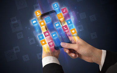 Female hand using smartphone with colorful angular fast switching application icons around