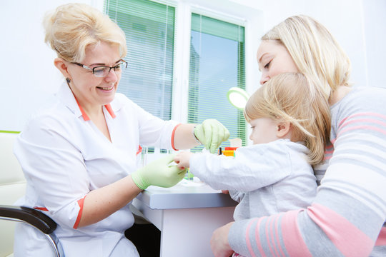 Blood Medical Test Or Research. Taking A Blood Sample From Child Finger In Hospital