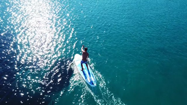 Aerial drone video of competition sport paddle surfing or sup in tropical Caribbean sea