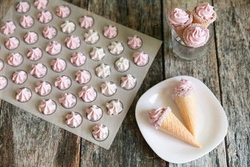 Small white and pink meringues or zephyr