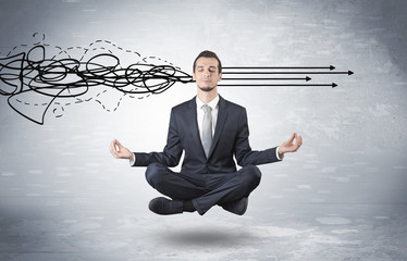 Businessman levitates in yoga position and systematize with thinking concept
