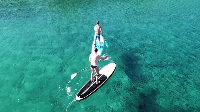 Aerial drone video of competition sport paddle surfing or sup in tropical Caribbean sea