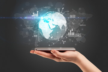 Hand using phone with multinational worldwide estate report concept
