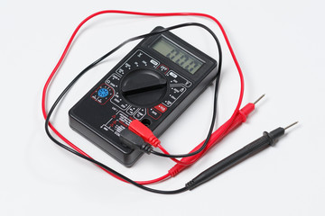 Tool for checking electrical circuits. Digital multimeter on white background