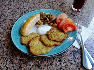 delicious potato pancakes with mushrooms and sausage