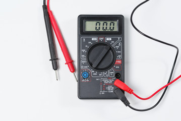 Tool for checking electrical circuits. Digital multimeter on white background