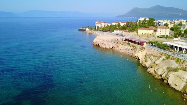 Aerial birds eye view video taken by drone of picturesque village of Aidipsos known for hot springs, North Evoia, Greece