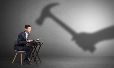 Shadow threatening hard worker man who is afraid
