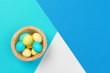Candy color easter eggs over bright paper background