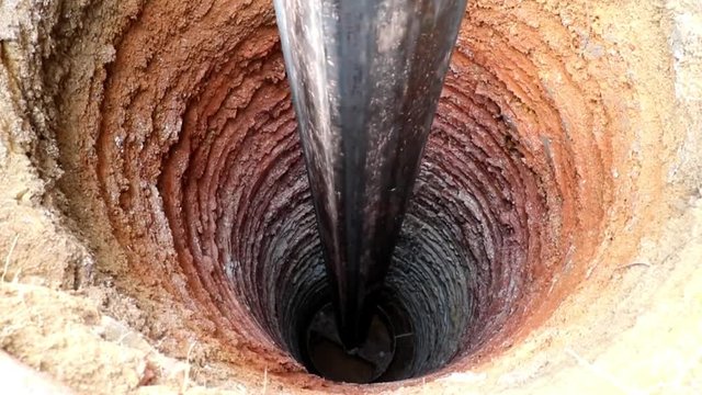 Water Well Drilling, holes boring in ground with drilling rig machine