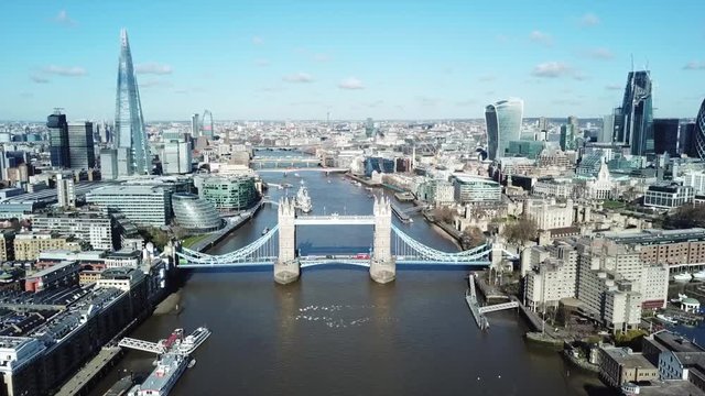Aerial drone bird's eye view video of iconic Tower Bridge and skyline in City of London, United Kingdom