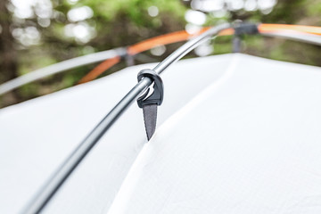 Close up detail of camping tent poles. Hiking equipment concept