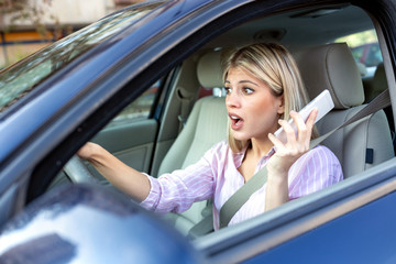Fototapeta na wymiar Young woman in shock during driving
