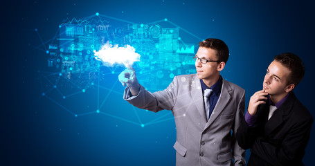 Man touching hologram projection displaying information from cloud based system
