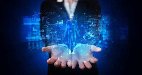 Young person holding hologram projection displaying health related graphs and symbols
