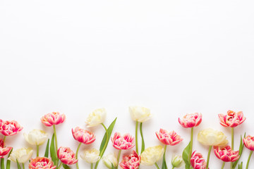 Spring flowers tulips on pastel colors background. Retro vintage style.
