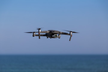 Fototapeta na wymiar Flying drone over the sea