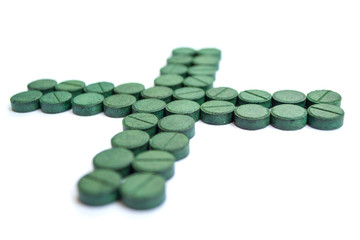 Supplement, spirulina tablets top view.