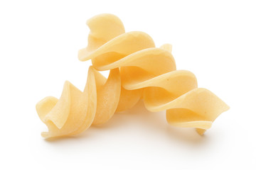 Italian twisted pasta fusilli isolated on white background. Fusilloni, rotini.