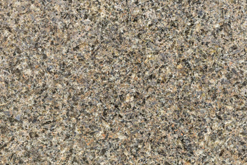 Marble texture with different colored spots. The surface of granite stone with streaks, spots and patterns of different colors. Visible stone texture with thick lines and mottled spots. 