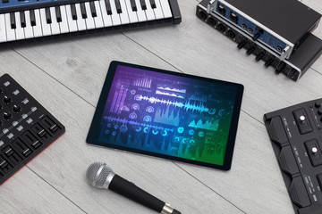 Electronic music instruments, microphone, piano, consoles and tablet with reports concept
