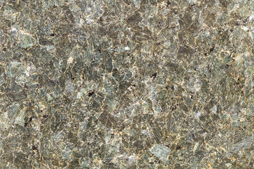 Marble texture with different colored spots. The surface of granite stone with streaks, spots and patterns of different colors. Visible stone texture with thick lines and mottled spots. 
