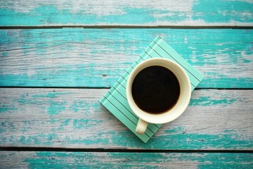  Close up of coffee cup on wooden table. 