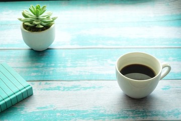  Close up of coffee cup on wooden table. 