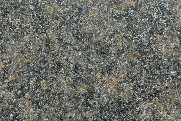 Marble texture with different colored spots. The surface of granite stone with streaks, spots and patterns of different colors. Visible stone texture with thick lines and mottled spots. 