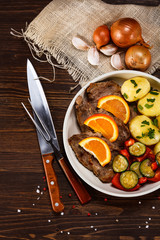 Grilled steak, boiled potatoes and vegetables