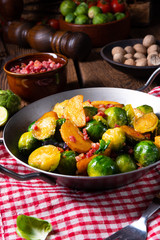 Brussels sprouts potato pan with bacon in rustic style