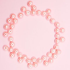 pink pearls on pink paper background