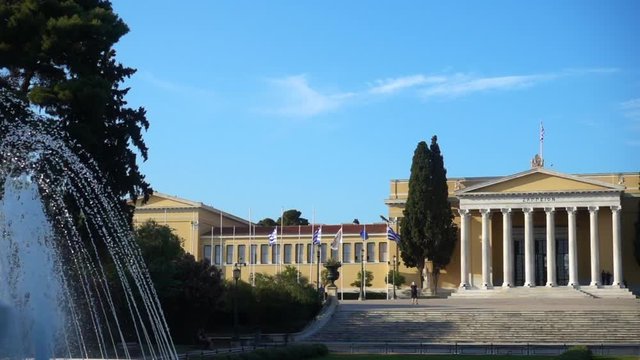 Slow motion video from iconic public Zappeion hall with Greek flag waving, Athens historic center, Attica, Greece