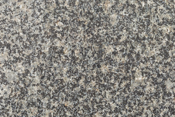 Marble texture with different colored spots. The surface of granite stone with streaks, spots and patterns of different colors. Visible stone texture with thick lines and mottled spots. 