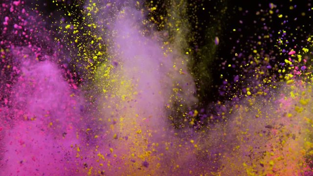 Super slowmotion shot of color powder explosion isolated on black background.