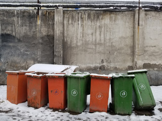 trash cans in snow