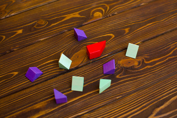 Children's wooden bricks, the designer on a dark background