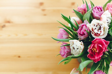 Beautiful double peony tulips in vase, top view with copy space. Colorful pink and purple tulips bouquet in vase. Happy mothers day. International women's day. Hello Spring. Greeting card
