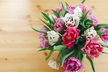 Beautiful double peony tulips in vase, top view with copy space. Colorful pink and purple tulips bouquet in vase. Happy mothers day. International women's day. Hello Spring. Greeting card