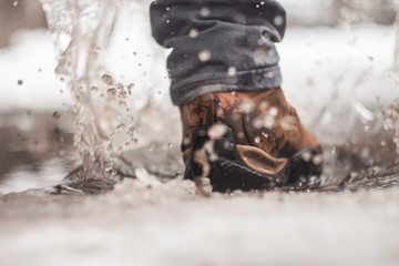 snow and water splashes from shoes