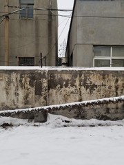 wall of an abandoned building with snow
