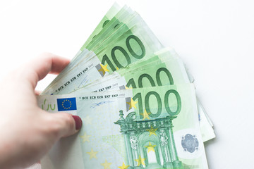 Hand with money isolated on a white background