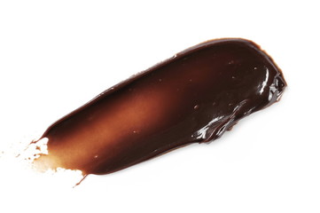 Melted chocolate, icing for cake and ice cream isolated on white background, top view