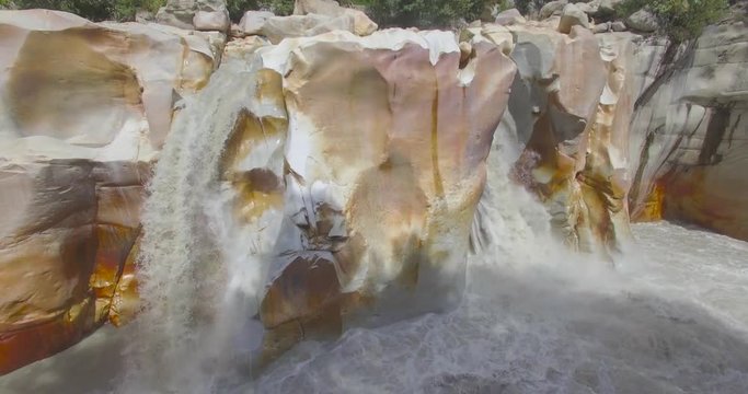 Surya Kund waterfall at Gangotri near Gangotri Temple, Himalayan Range Uttarakhand India.Pay obeisance to Sun God Waterfall Surya Kund on holy river Ganges on background mountain town Gangotri deodar.