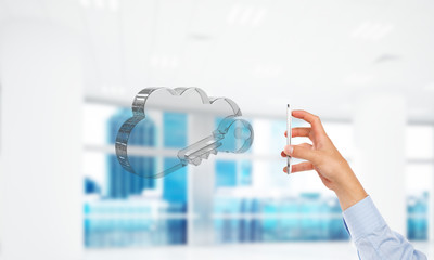 Male hand with smartphone and cloud computing concept in modern interior. Mixed media